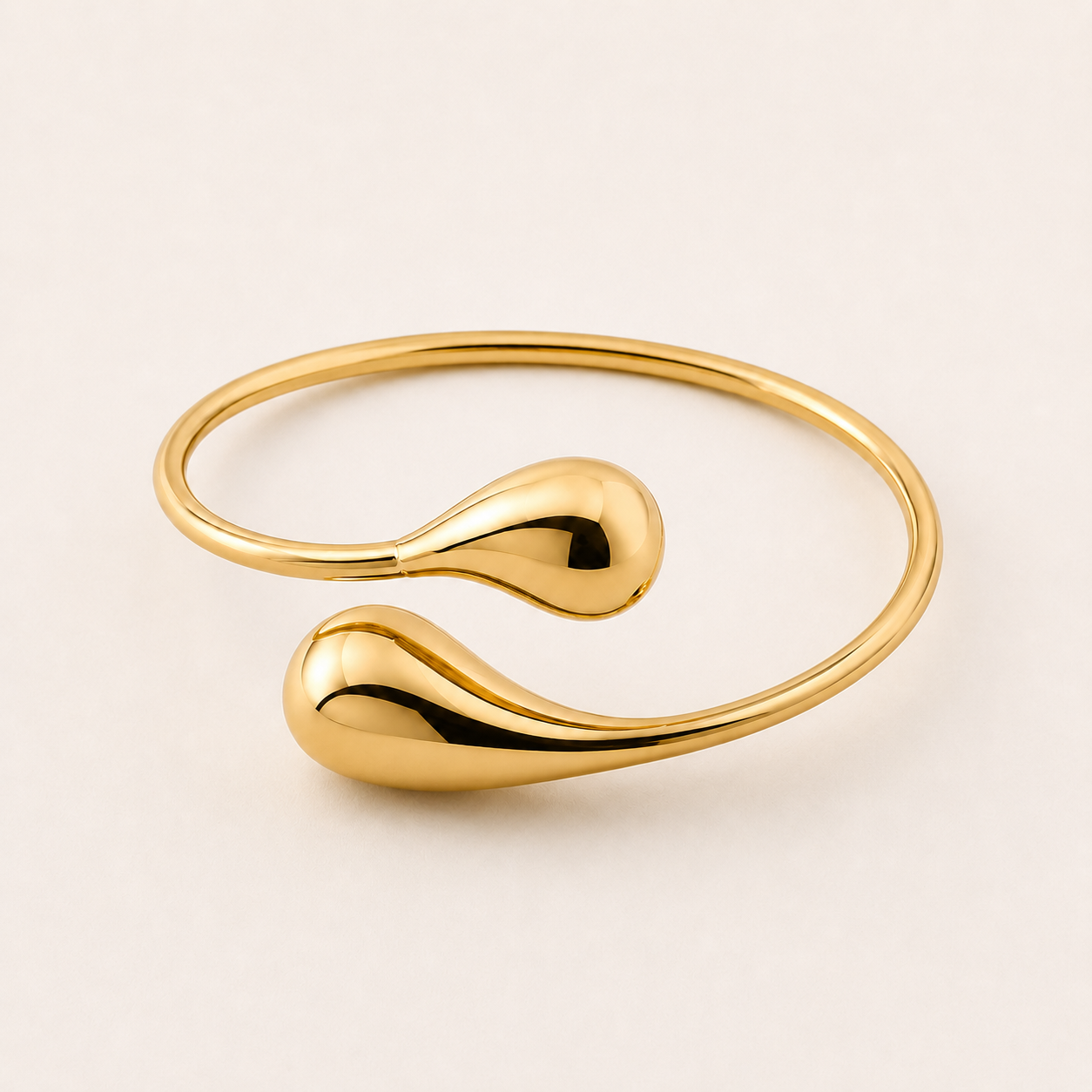 Gold bracelet with a unique design on a beige background